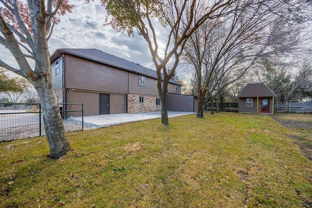 view of yard with a patio area and a shed