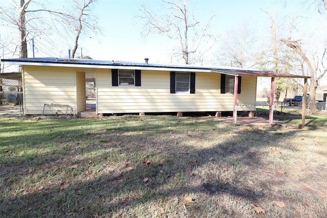 back of house with a yard