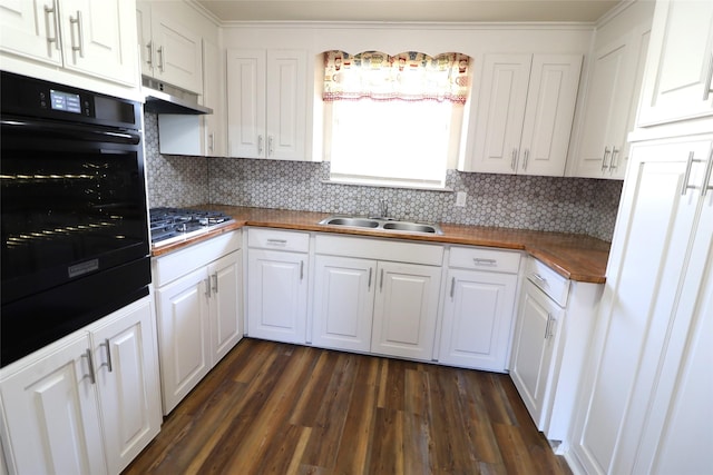 kitchen with sink, dark hardwood / wood-style flooring, oven, extractor fan, and white cabinets