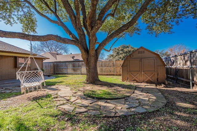 view of yard featuring a patio area and a storage shed