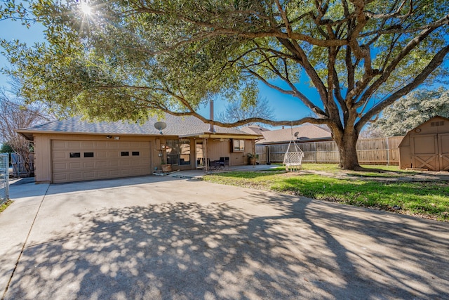 ranch-style house with a front yard and a garage