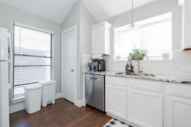 kitchen with light stone countertops, dishwasher, sink, tasteful backsplash, and white cabinets