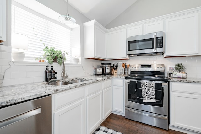 kitchen featuring white cabinetry, sink, and appliances with stainless steel finishes