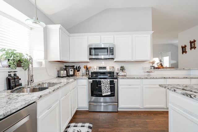 kitchen with white cabinets, pendant lighting, stainless steel appliances, and sink