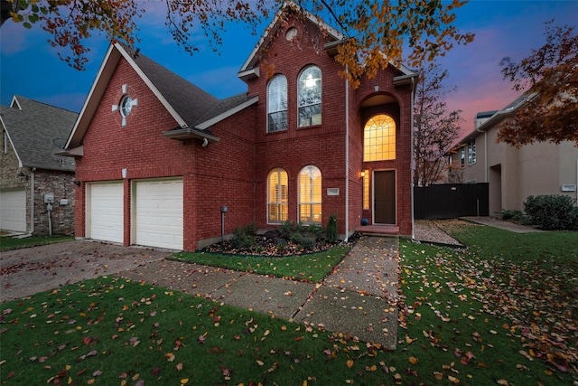 view of front property featuring a yard and a garage