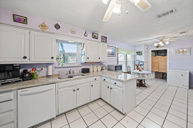 kitchen featuring ceiling fan, a sink, visible vents, white cabinets, and dishwasher