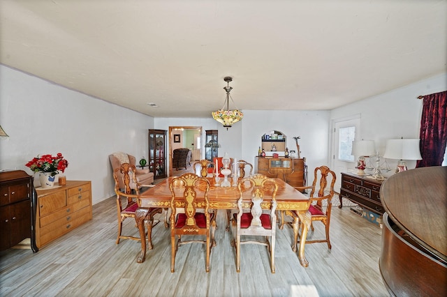 dining space with light wood-style floors