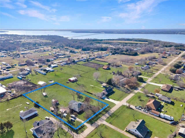 drone / aerial view featuring a water view and a residential view