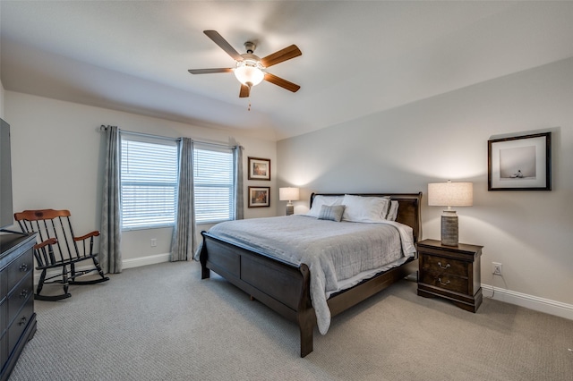 bedroom featuring ceiling fan and light carpet