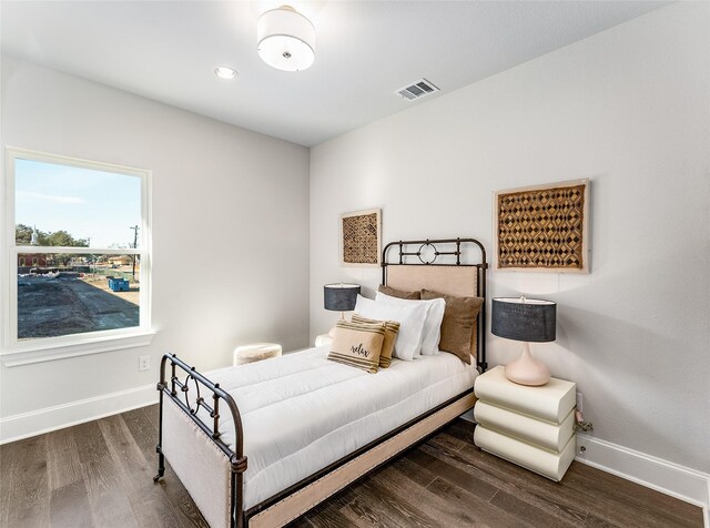 bedroom featuring ceiling fan, wood-type flooring, and lofted ceiling