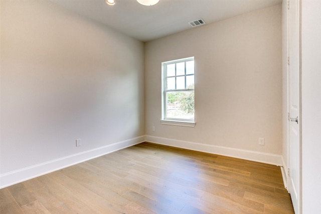 unfurnished room with light hardwood / wood-style flooring