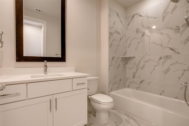 full bathroom featuring vanity, toilet, and tiled shower / bath