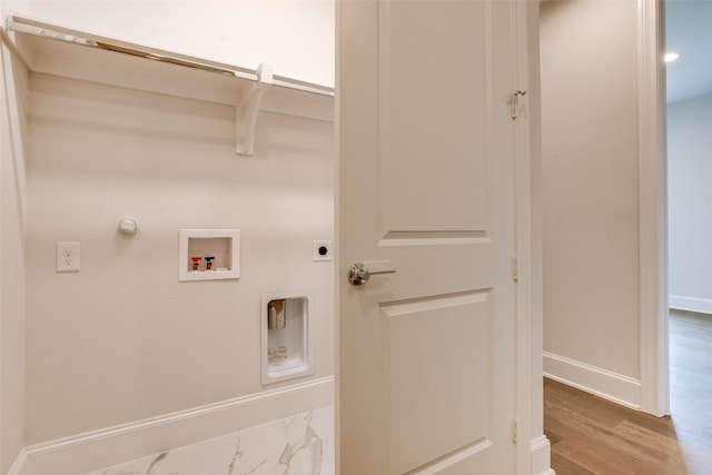 laundry area with electric dryer hookup, hookup for a gas dryer, hookup for a washing machine, and hardwood / wood-style floors