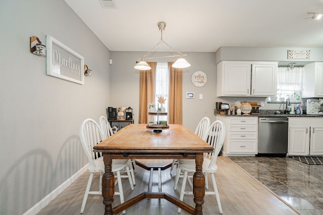 dining area with wood-type flooring