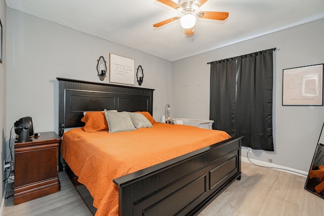 bedroom with light wood-type flooring and ceiling fan