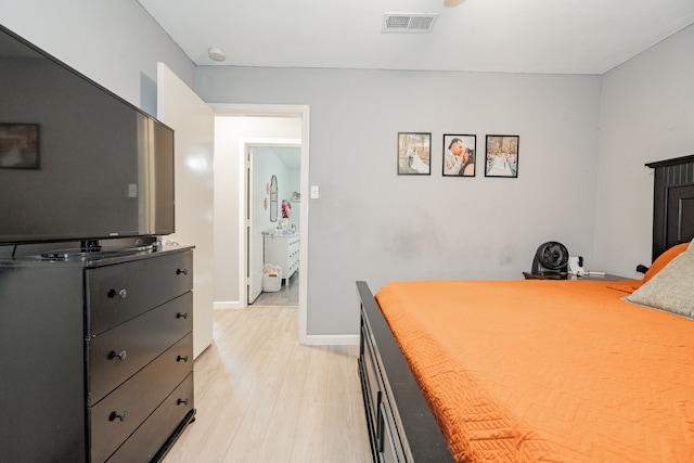 bedroom with light wood-type flooring