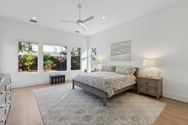 bedroom with hardwood / wood-style floors and ceiling fan