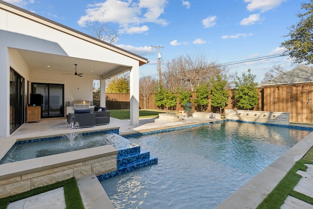 view of pool with a patio, pool water feature, grilling area, ceiling fan, and a hot tub