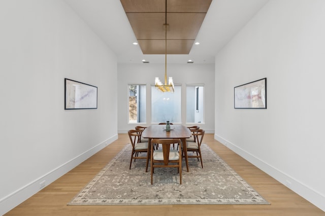 dining room featuring a notable chandelier and light wood-type flooring