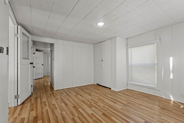 spare room with light wood-type flooring