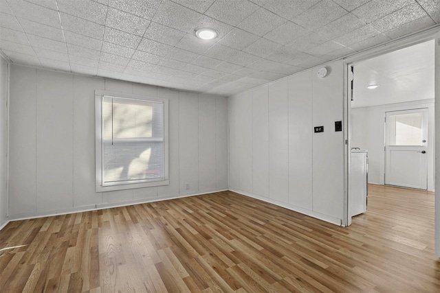 unfurnished room featuring light hardwood / wood-style flooring