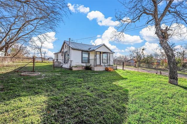 view of side of home featuring a yard