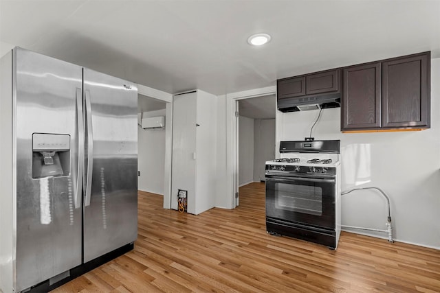 kitchen featuring stainless steel refrigerator with ice dispenser, dark brown cabinetry, range with gas cooktop, light wood-type flooring, and exhaust hood