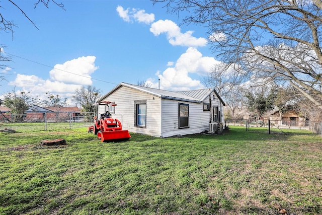 view of home's exterior with a lawn