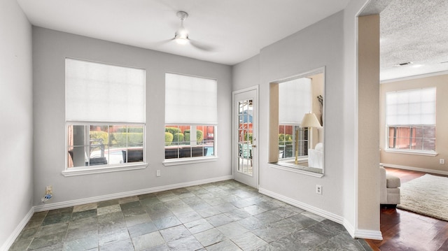 doorway with a textured ceiling