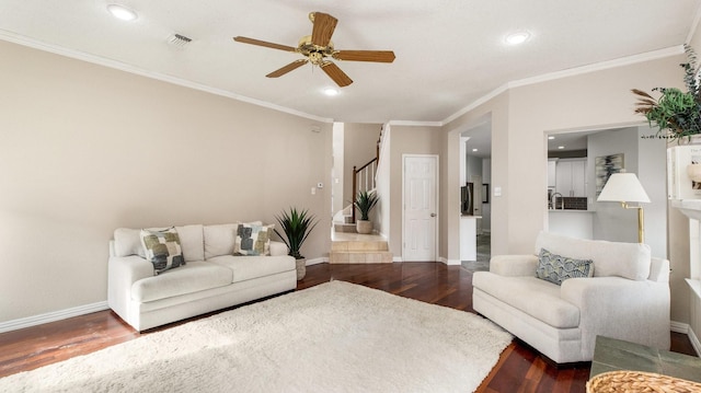 living room with ceiling fan, ornamental molding, and dark hardwood / wood-style floors