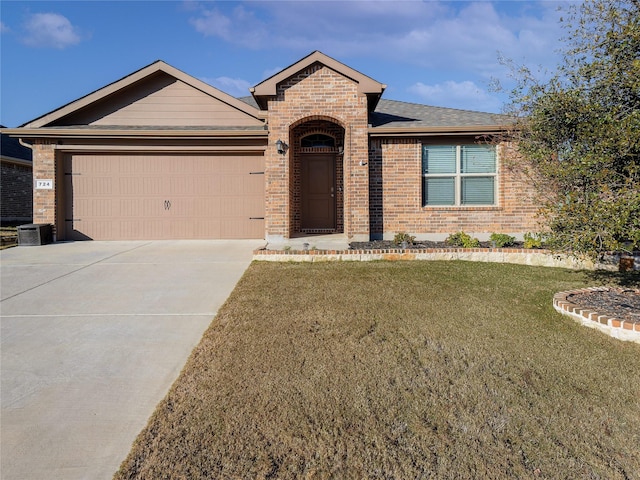 ranch-style house featuring a garage and a front lawn