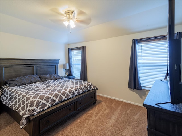 bedroom featuring ceiling fan, carpet, and lofted ceiling