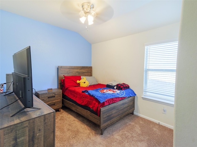 carpeted bedroom with ceiling fan and lofted ceiling