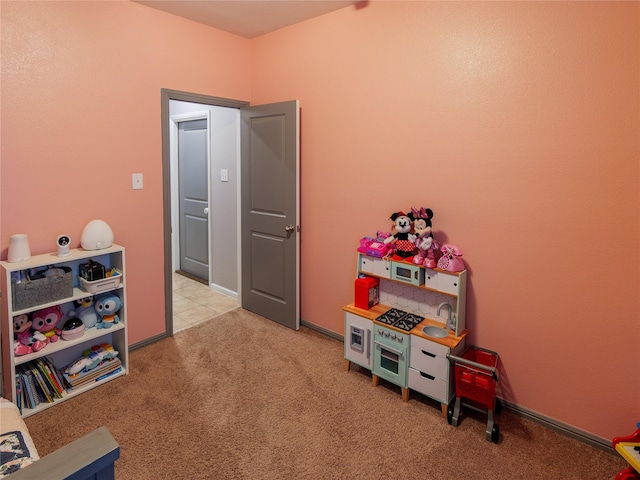 playroom featuring light colored carpet