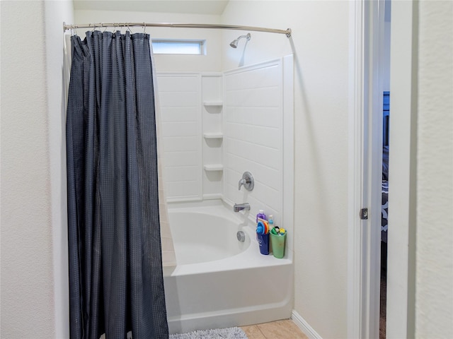 bathroom with tile patterned flooring and shower / bath combination with curtain