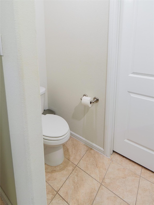 bathroom featuring tile patterned floors and toilet