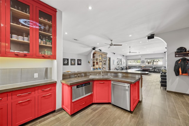 kitchen featuring dishwasher, sink, ceiling fan, and light hardwood / wood-style flooring