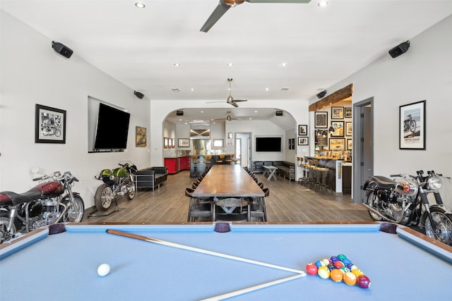 game room featuring bar, wood-type flooring, pool table, and ceiling fan