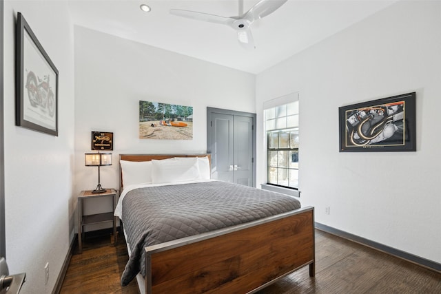 bedroom featuring dark hardwood / wood-style flooring, a closet, and ceiling fan