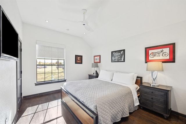 bedroom with dark wood-type flooring, ceiling fan, and lofted ceiling