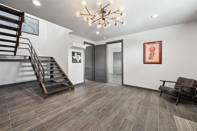 interior space with a notable chandelier, dark hardwood / wood-style flooring, and an AC wall unit