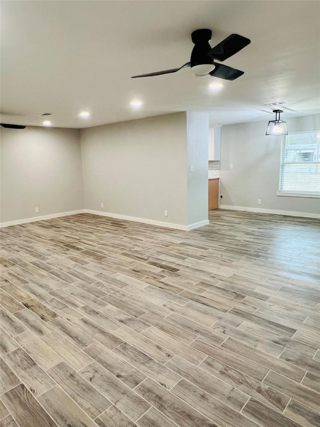 interior space with ceiling fan and light wood-type flooring