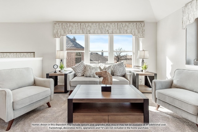 carpeted living room with lofted ceiling