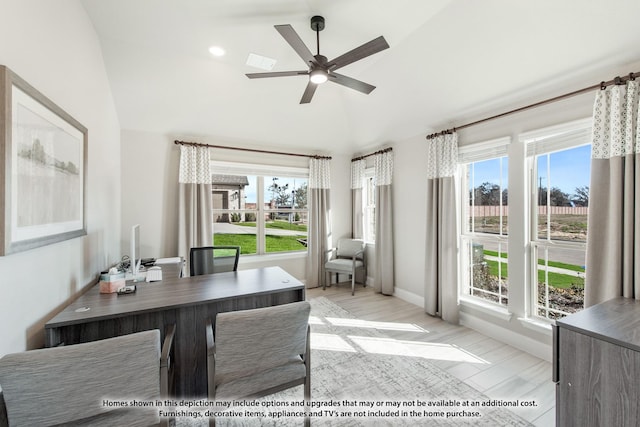 interior space with ceiling fan, lofted ceiling, and light wood-type flooring