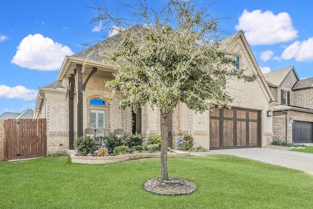 view of front facade with a front yard and a garage