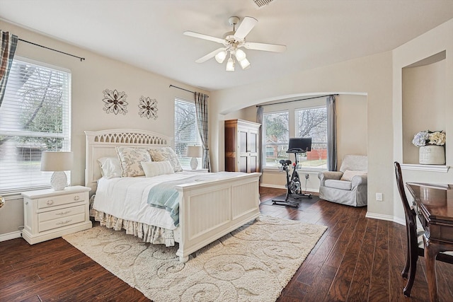 bedroom with ceiling fan and dark hardwood / wood-style floors