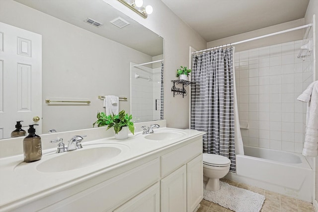 full bathroom featuring tile patterned flooring, vanity, toilet, and shower / bathtub combination with curtain