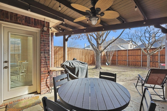 view of patio with ceiling fan and grilling area