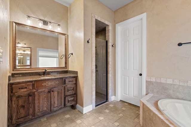 bathroom featuring independent shower and bath and vanity