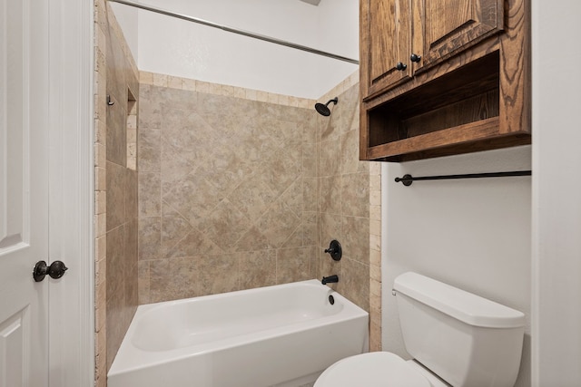 bathroom with toilet and tiled shower / bath combo